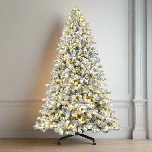 Joy By 9.5' Flocked Christmas tree with 1200 Warm White LED Lights - Joy By